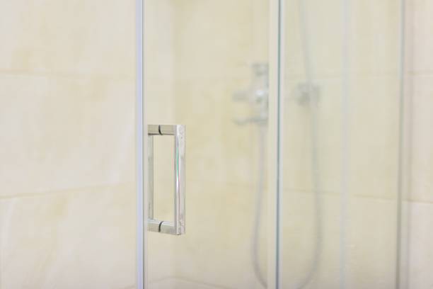 istock Shower, bathroom interior, light beige, glass door with chrome handle 1213470837