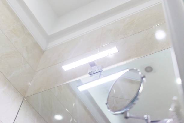 istock LED light above the washbasin mirror, cosmetic makeup mirror 1213473179