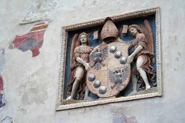 Coat of arms (1509) on the façade of the ancient Palazzo Municipale in the historic center of Riva del Garda (Trento, Italy).