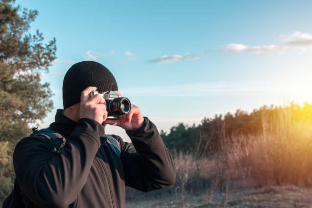 istock photographer takes photo on camera 1213473755