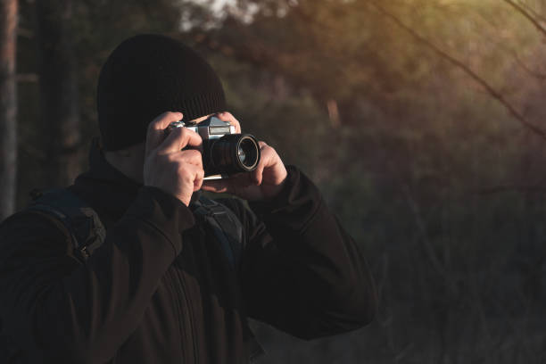 istock photographer takes photo on camera 1213473773
