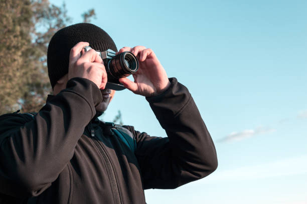 istock photographer takes photo on camera 1213474212