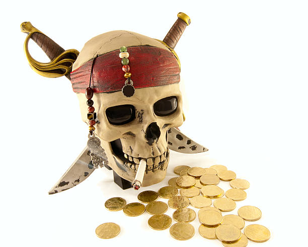 istock skeleton pirate skull with metal coins and a cigarette 121347480
