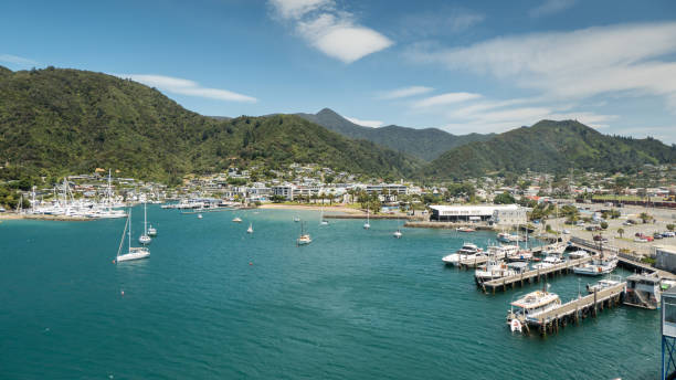 Panoramic view of Picton, South Island, New Zealand Nestled at the head of Queen Charlotte Sound in the beautiful Marlborough Sounds, Picton is possibly New Zealand’s prettiest seaside town. Picton’s waterfront has one of the world’s best water views, known for its ever changing colours. The two local marinas are a stunning testament to the importance of boats, to this charming waterside village. picton new zealand stock pictures, royalty-free photos & images