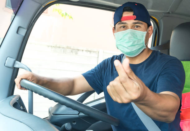 istock Truck driver wearing a mask 1213479227