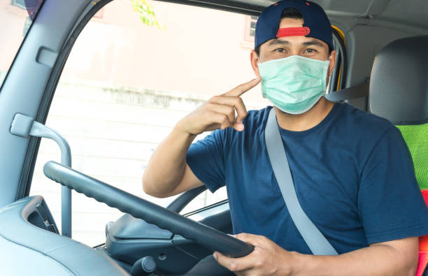 istock Truck driver wearing a mask 1213479228