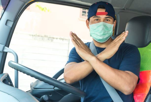 istock Truck driver wearing a mask 1213479254