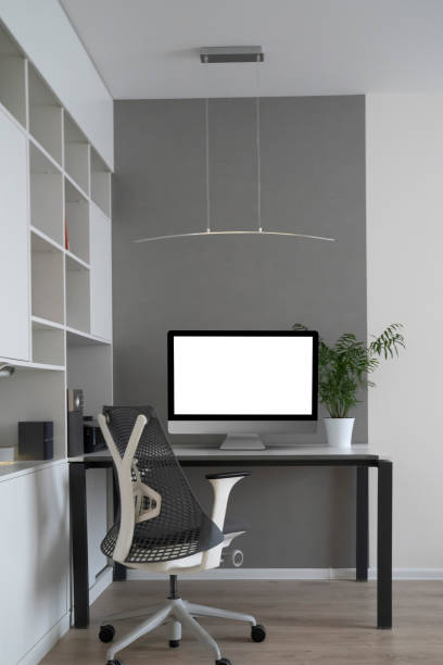istock Home working place with modern desk and mock-up computer monitor. 1213480470