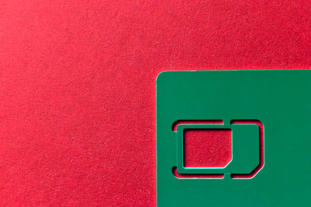 istock Green card from under the SIM card on a red background 1213480490