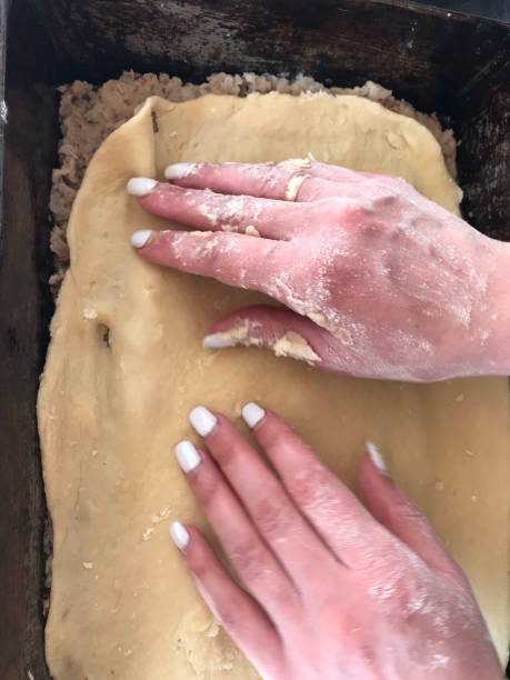 istock Young woman kneading dough.  Baking bread.  Cooking. 1213480700