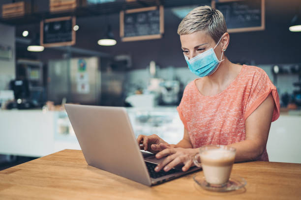 istock Young woman working indoors during flu epidemic 1213482804