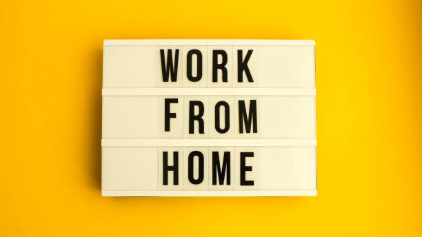 istock lightbox with text WORK FROM HOME in front yellow background, copy space, banner for freelance coronavirus quarantine isolation 1213483772