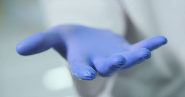 istock Sceintist hands in protective gloves. Science Laboratory. 1213485011