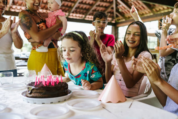 istock Blowing out candles on birthday 1213485271