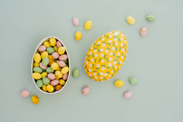 Easter eggs and candy in pastel color from above overhead Flat lay still life of easter egg on turquoise