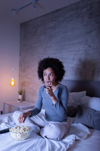istock Woman watching television 1213486653