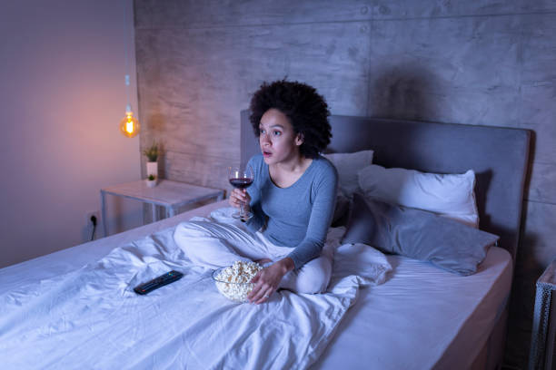 istock Woman watching TV 1213486669