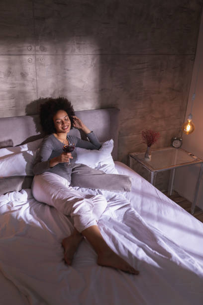 istock Woman relaxing and drinking wine 1213486868
