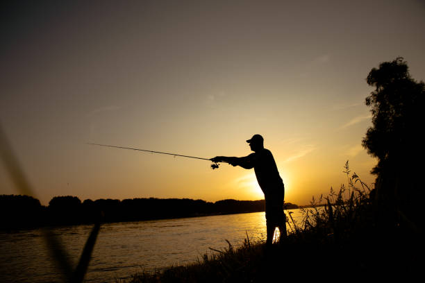 istock Men fishing on the river 1213486920