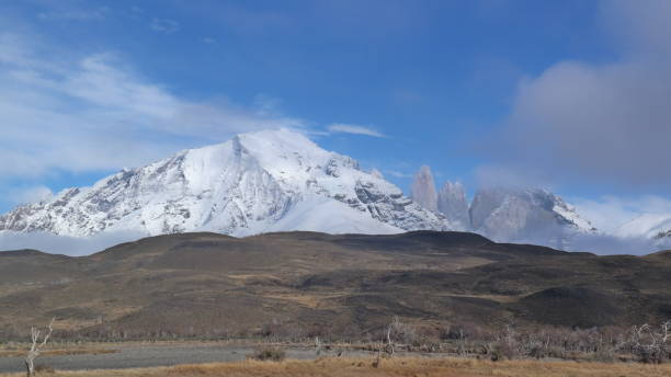 istock Blue snow mountain and beautiful tracking course 1213486978