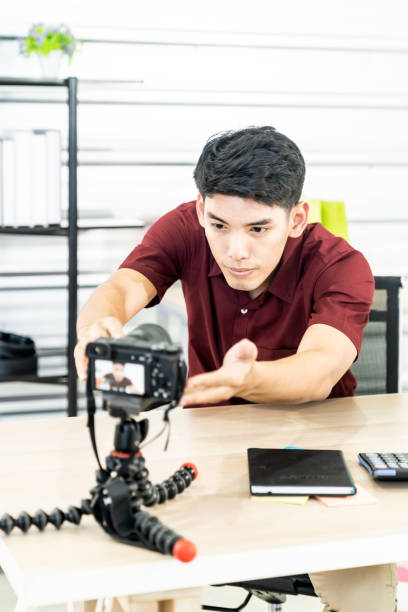 istock Vlogger blogger set up live camera 1213489373