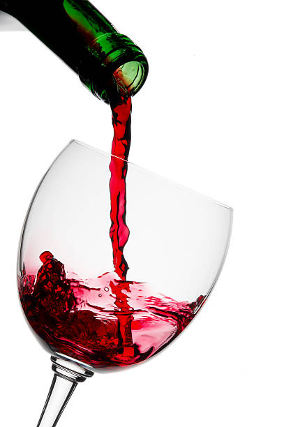 istock Red wine poured in a glass 121348959