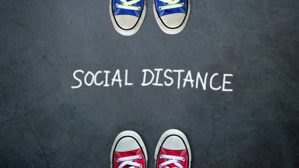 istock Social distance. two people keep spaced between each other for social distancing, increasing the physical space between people to avoid spreading illness during transmission of COVID-19 outbreak 1213492337