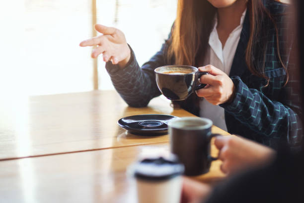 istock people enjoyed talking and drinking coffee together in cafe 1213492617