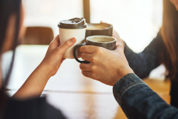 istock people enjoyed drinking and clinking coffee cups on the table in cafe 1213492647