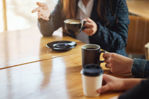 istock people enjoyed talking and drinking coffee together in cafe 1213492679
