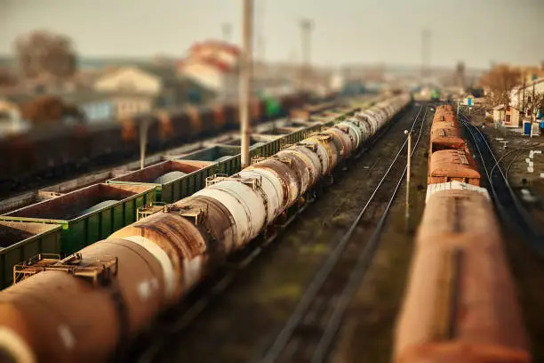 Freight railway cars at the railway station. Top view of cargo trains.Wagons with goods on railroad. Heavy industry. Industrial conceptual scene with trains. selective focus.
