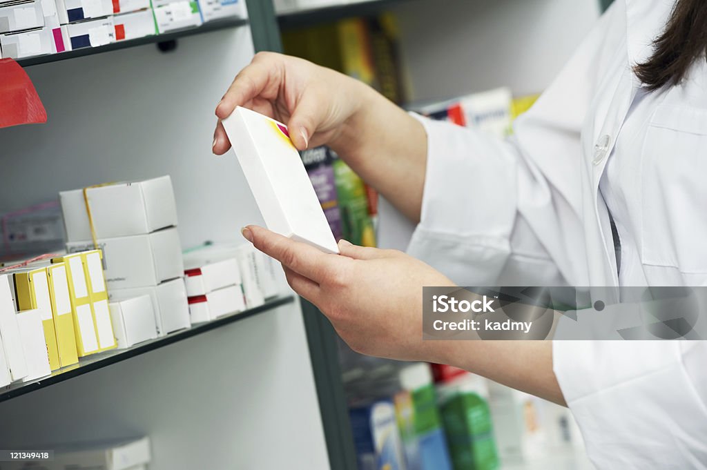closeup hand of chemist with drug  Adult Stock Photo