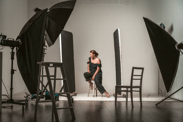 istock Backstage shooting attractive model in black dress 1213496247