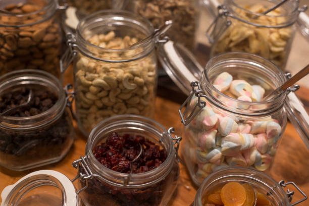 istock Healthy nuts in the glass bottle isolated 1213496943