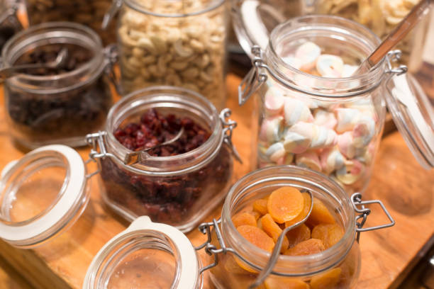istock Healthy nuts in the glass bottle isolated 1213496958