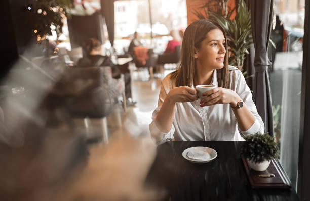 istock Woman in coffee shop 1213498420
