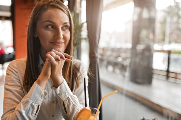 istock Pretty woman in coffee shop 1213498594