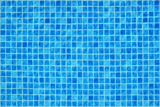 istock Top view of clear water in a blue tile pool background. Ripple effect 1213499392