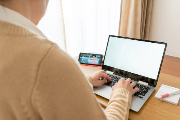 asian businesswoman having video conference meeting from home - camel back imagens e fotografias de stock