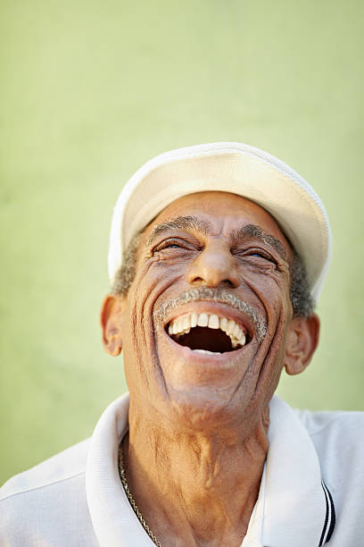 istock aged latino man smiling for joy 121350335