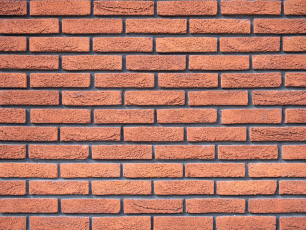 istock Old brick wall, old texture of red stone blocks closeup 1213503371