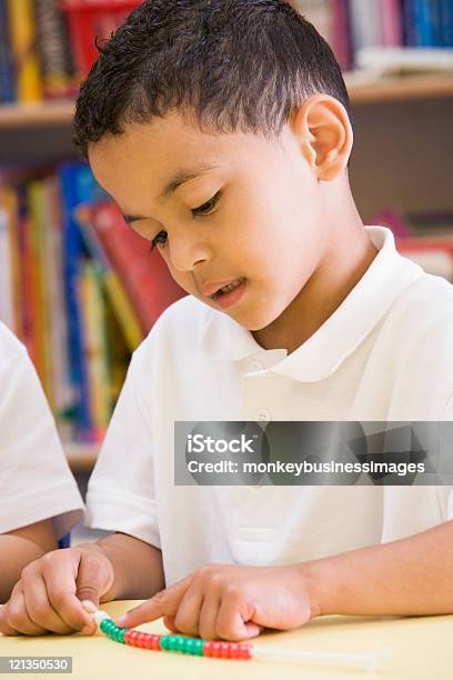 Schoolboy In A Primary Class Stock Photo - Download Image Now - Bead, Boys, Counting