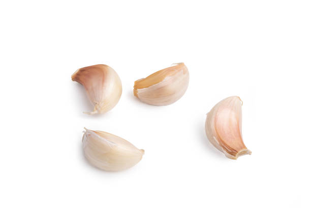白い背景に分離された4クローブニンニク - garlic clove isolated white ストックフォトと画像