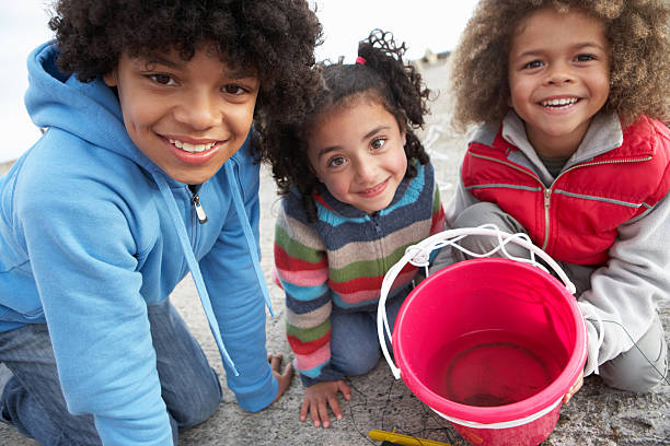 Children fishing for crabs  crabbing stock pictures, royalty-free photos & images