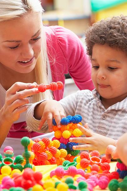 istock Young woman playing with boy 121350579