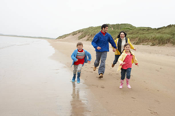 istock Happy family on beach 121350600