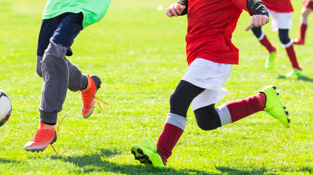 istock Boys play soccer on the field 1213506192