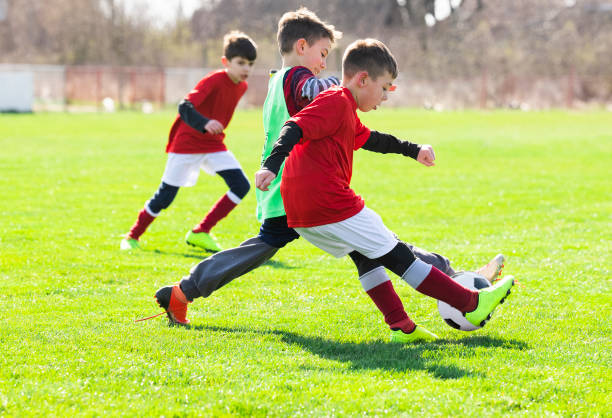 istock Boys play soccer on the field 1213506205