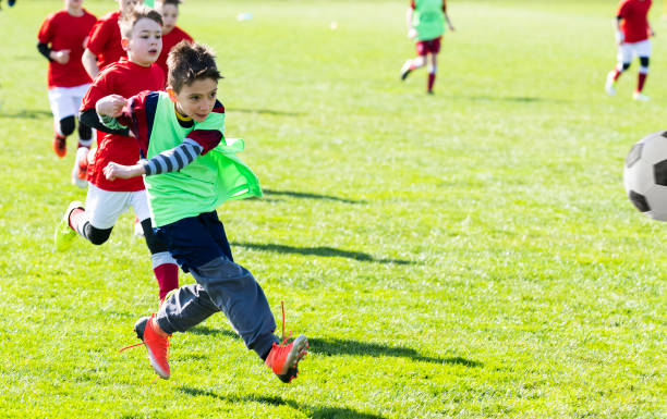 istock Boys play soccer on the field 1213506224