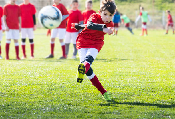 istock Boys play soccer on the field 1213506225